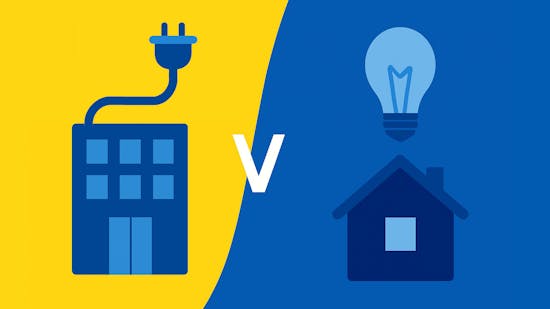 An office building, attached to a power cable, versus a house with a light bulb above it
