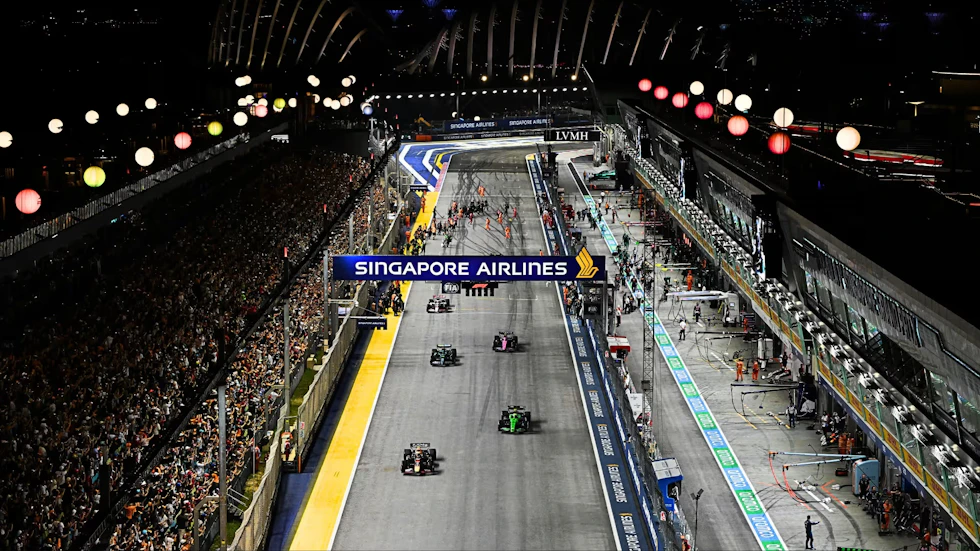 Cars pulling away from their grid spots before the 2025 Singapore GP.